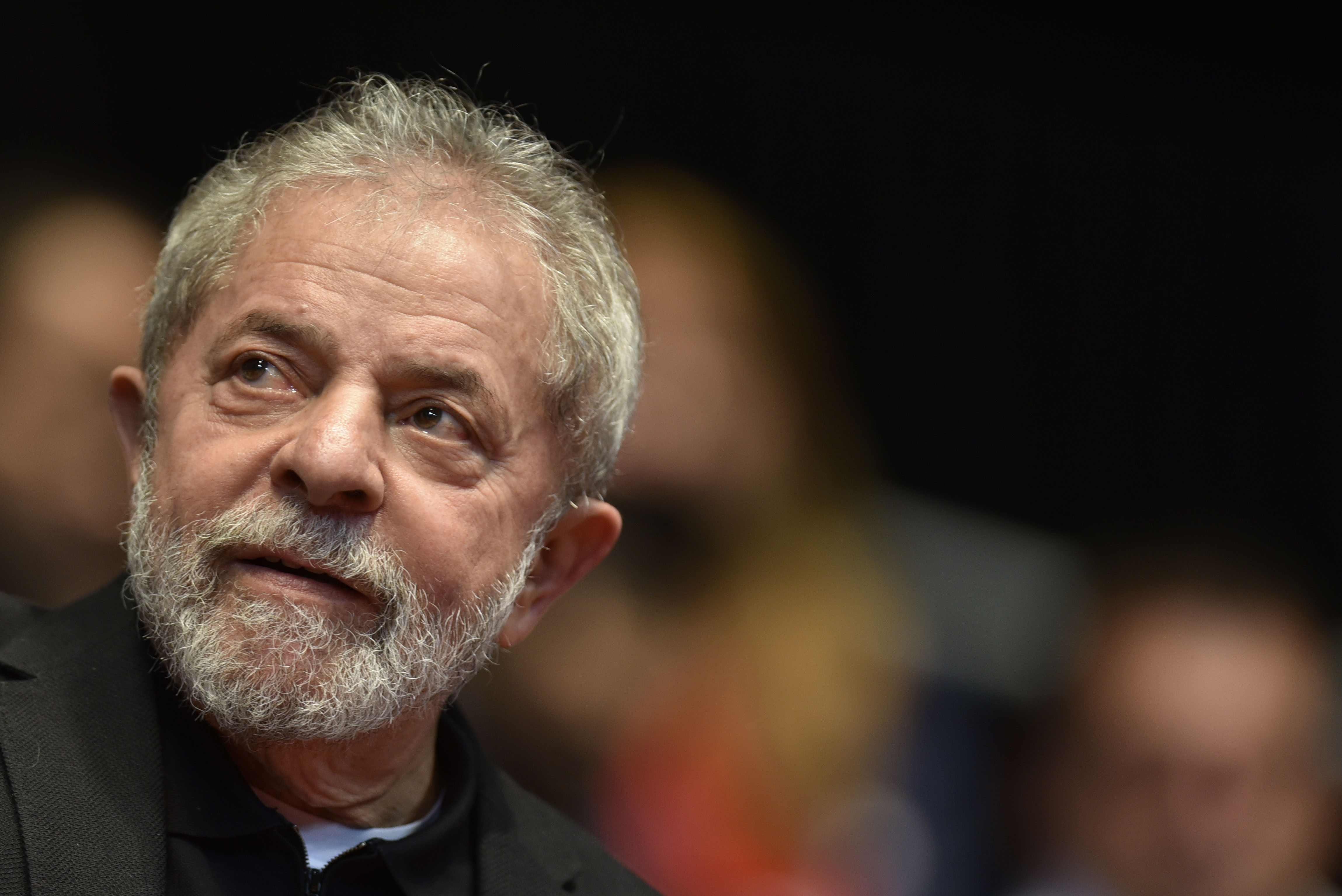 (FILES) This file photo taken on August 29, 2015 shows Brazilian former president (2003-2011) Luiz Inacio Lula Da Silva participating in the 12th Congress of the Brazilian Workers Union (CUT) in Belo Horizonte, Brazil, on August 28, 2015. 
Brazil police search home on March 4, 2016 of ex-president Lula da Silva in corruption probe.  / AFP / DOUGLAS MAGNO